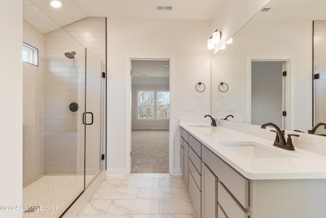 bathroom with vanity, an enclosed shower, lofted ceiling, and plenty of natural light