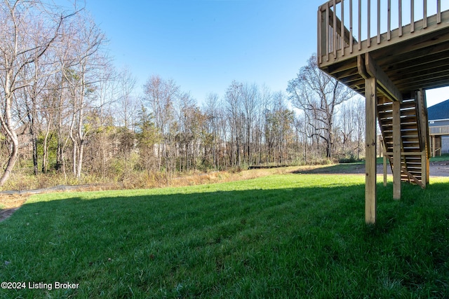 view of yard featuring a wooden deck