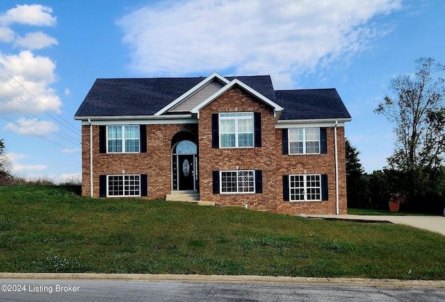 bi-level home with a front yard