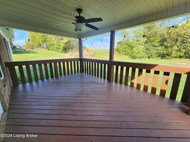 wooden terrace with a yard and ceiling fan