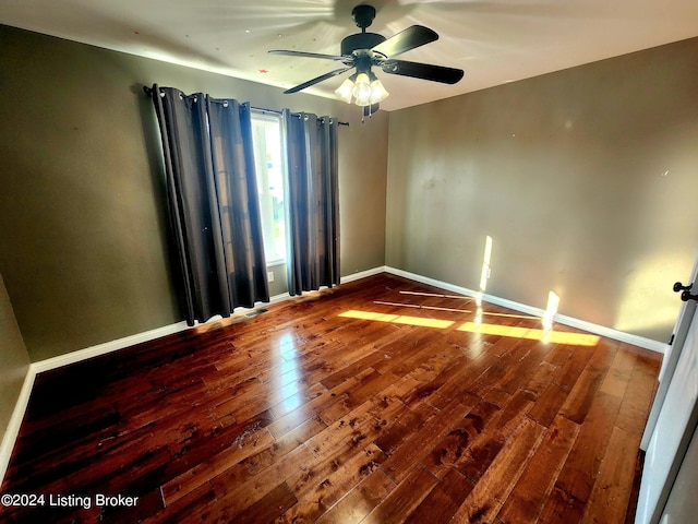 spare room featuring ceiling fan and hardwood / wood-style floors