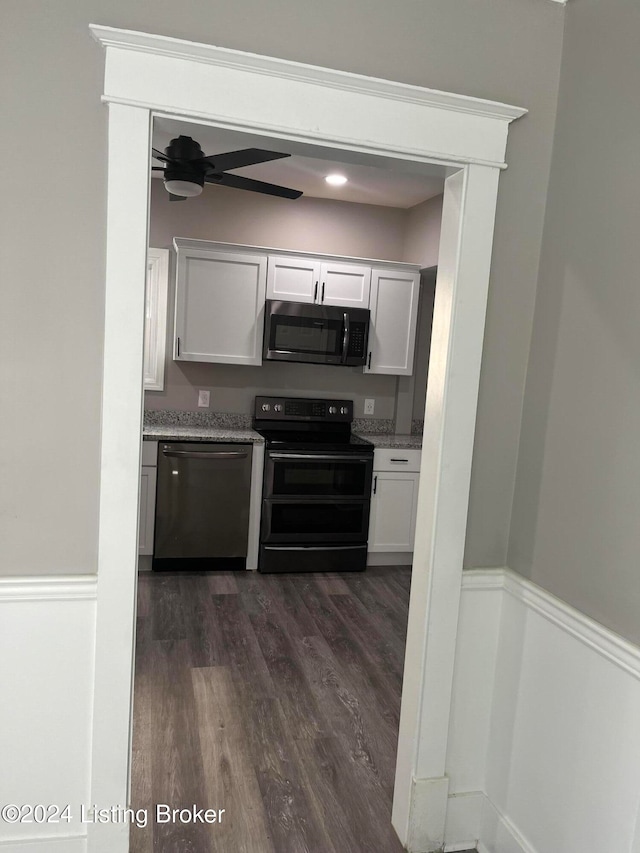 kitchen with stainless steel appliances, dark hardwood / wood-style floors, white cabinets, and ceiling fan