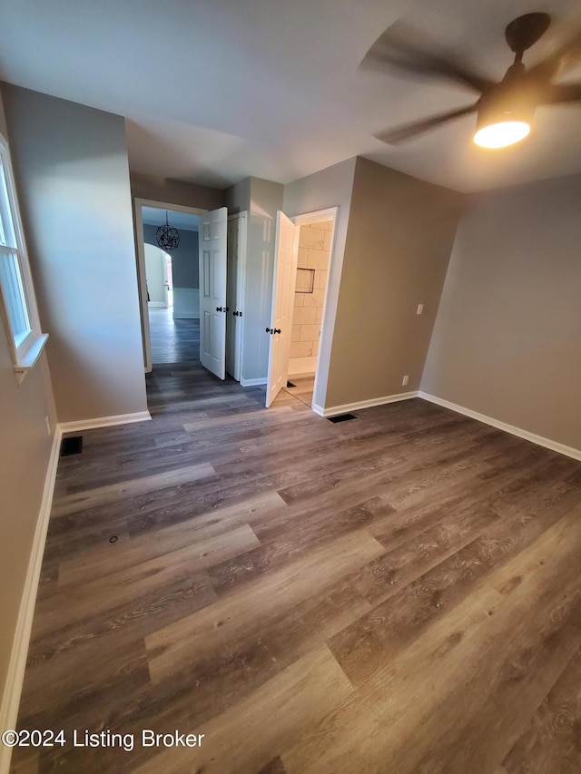 empty room featuring dark hardwood / wood-style flooring