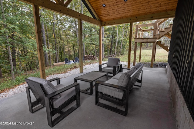 sunroom / solarium with lofted ceiling and wood ceiling