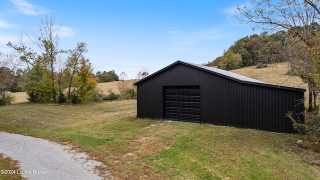 garage with a yard