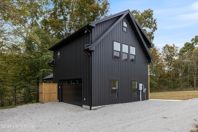 view of side of home featuring a garage