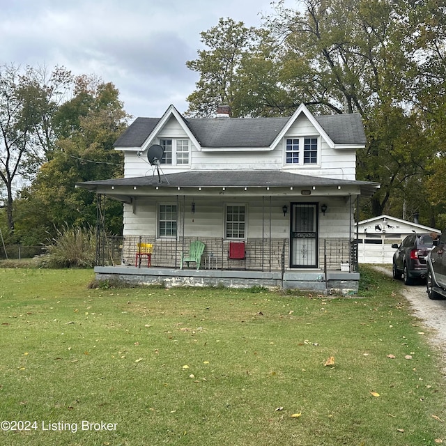 view of front facade with a front lawn and covered porch