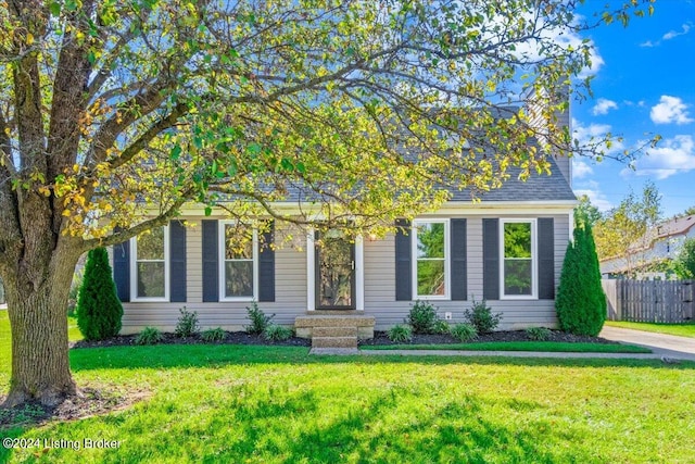 obstructed view of property featuring a front yard