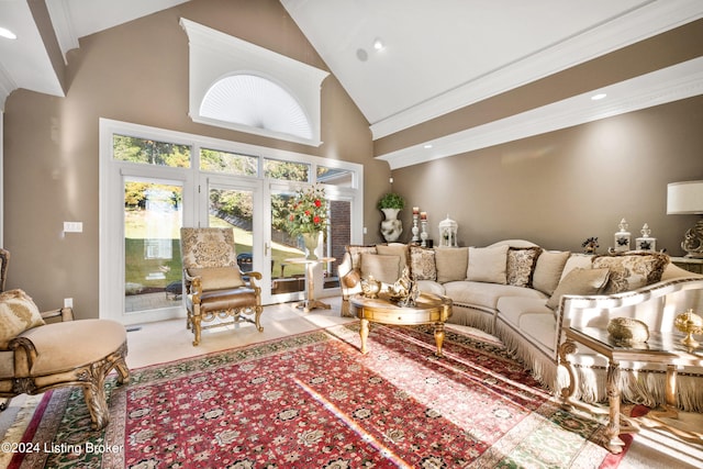 living room featuring crown molding and high vaulted ceiling