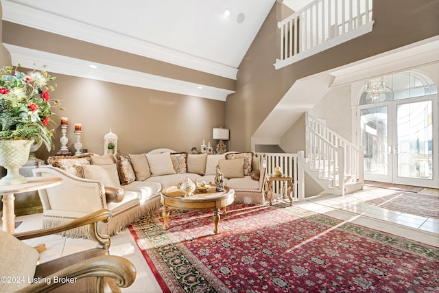 living room with french doors, ornamental molding, high vaulted ceiling, and tile patterned flooring