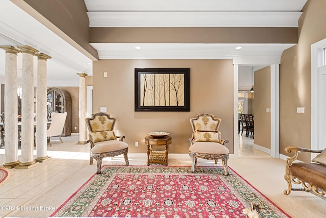 sitting room featuring ornate columns, carpet, ornamental molding, and beam ceiling