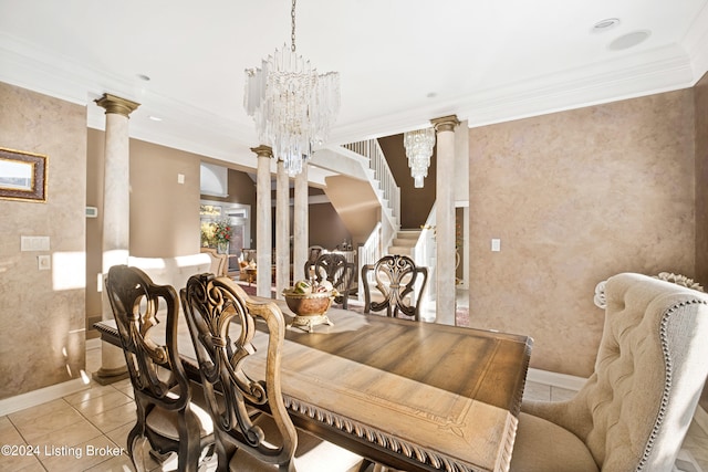 tiled dining space featuring a notable chandelier, crown molding, and ornate columns