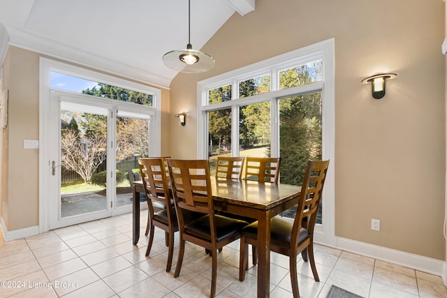 tiled dining area with beamed ceiling, high vaulted ceiling, and plenty of natural light