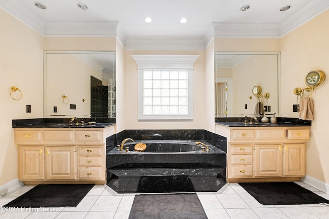 bathroom with vanity, crown molding, a bathtub, and tile patterned flooring