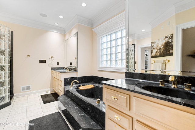 bathroom with vanity, tile patterned floors, ornamental molding, and a washtub