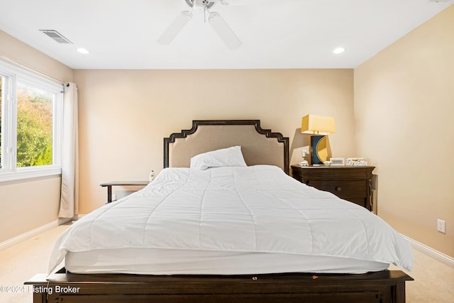 bedroom with light colored carpet and ceiling fan