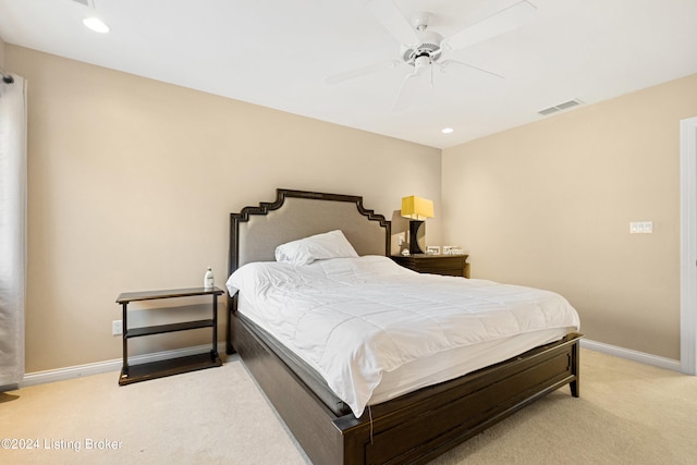 bedroom featuring light colored carpet and ceiling fan