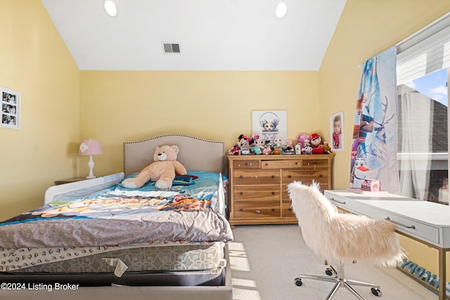 carpeted bedroom with lofted ceiling