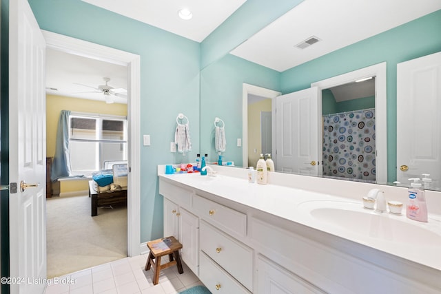 bathroom featuring vanity, ceiling fan, a shower with curtain, and tile patterned flooring