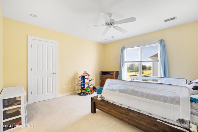 carpeted bedroom with ceiling fan