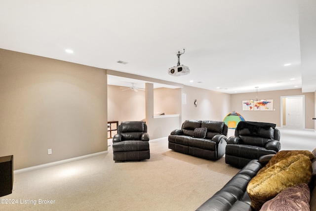 carpeted living room featuring ceiling fan