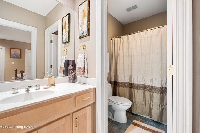 bathroom featuring vanity, curtained shower, toilet, and tile patterned flooring