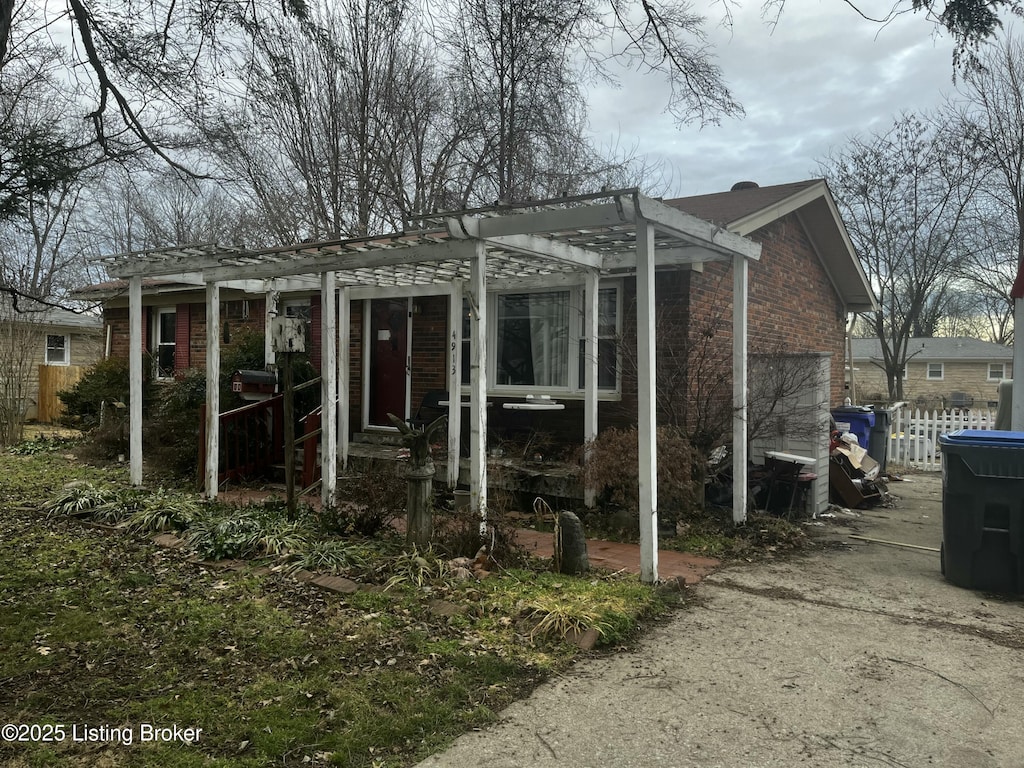 view of home's exterior with a pergola