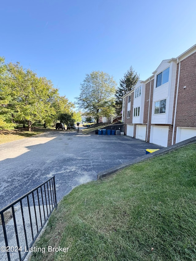 view of car parking with a garage