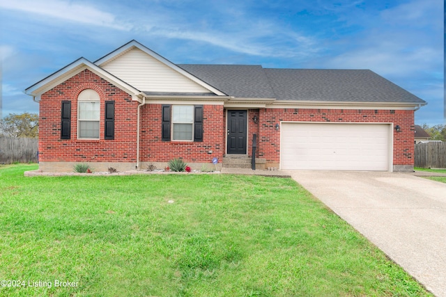 single story home featuring a front yard and a garage