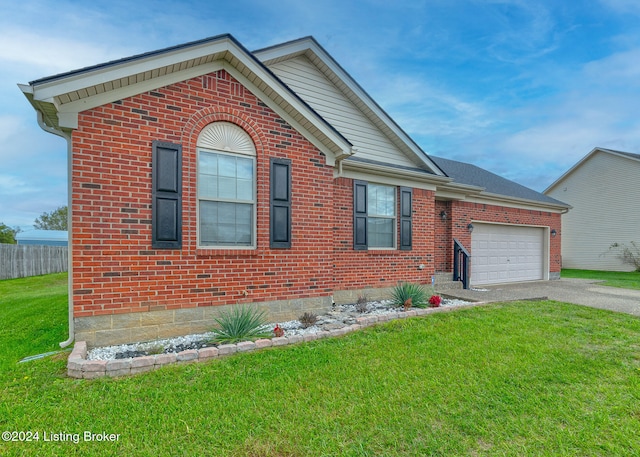 view of front facade with a front yard and a garage