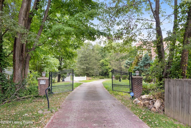 view of gate featuring a yard