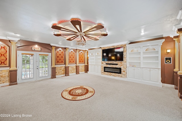 unfurnished living room with light colored carpet, decorative columns, and ornamental molding