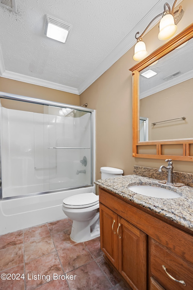 full bathroom featuring bath / shower combo with glass door, a textured ceiling, vanity, and toilet