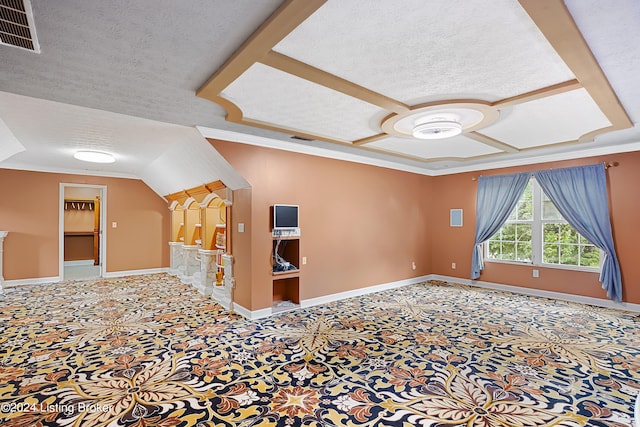 interior space with lofted ceiling, crown molding, and a textured ceiling