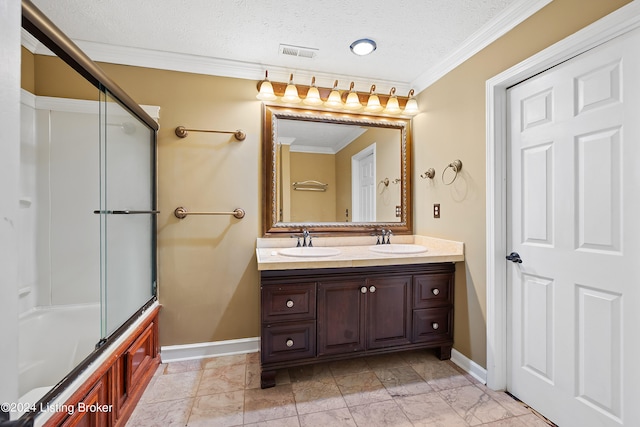 bathroom featuring a textured ceiling, crown molding, vanity, and enclosed tub / shower combo