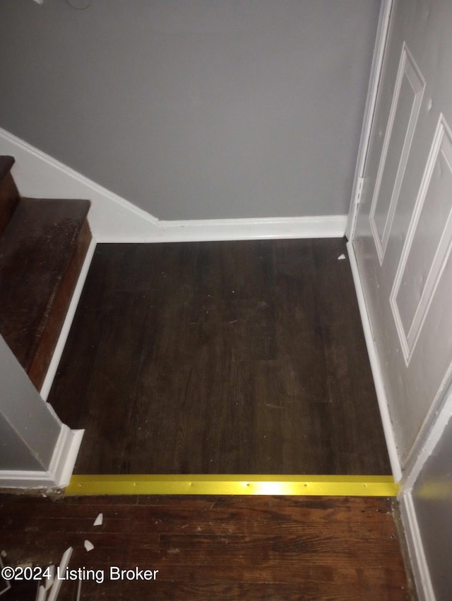 staircase featuring hardwood / wood-style floors