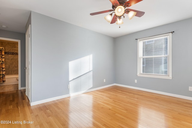 unfurnished room featuring ceiling fan and light wood-type flooring