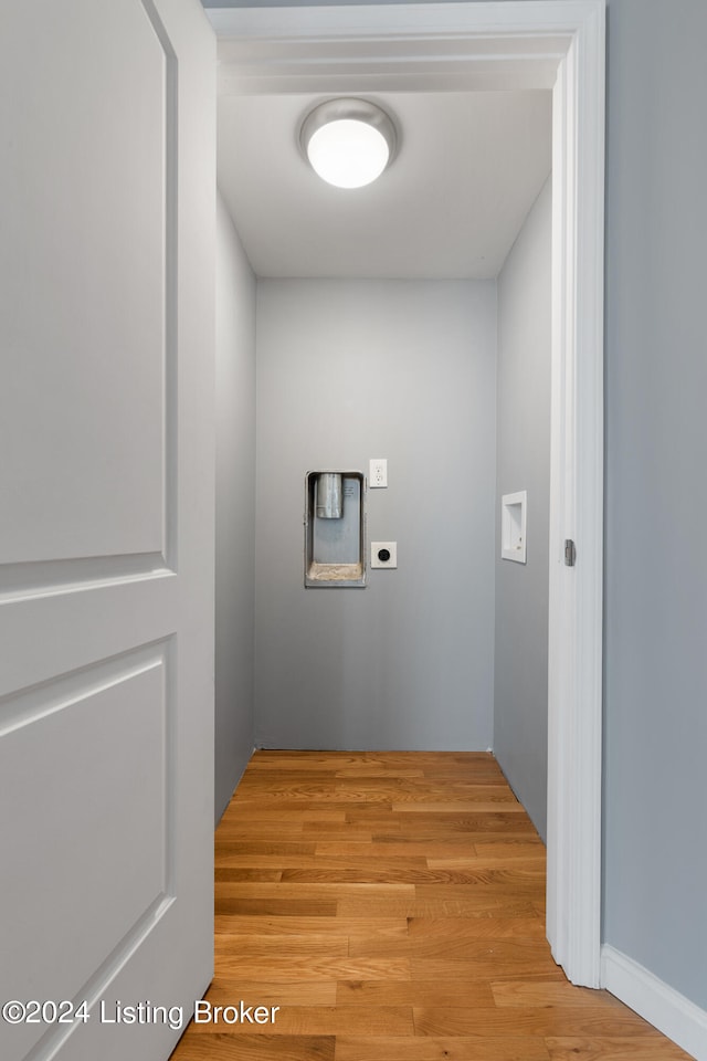 laundry room featuring light hardwood / wood-style floors and hookup for an electric dryer