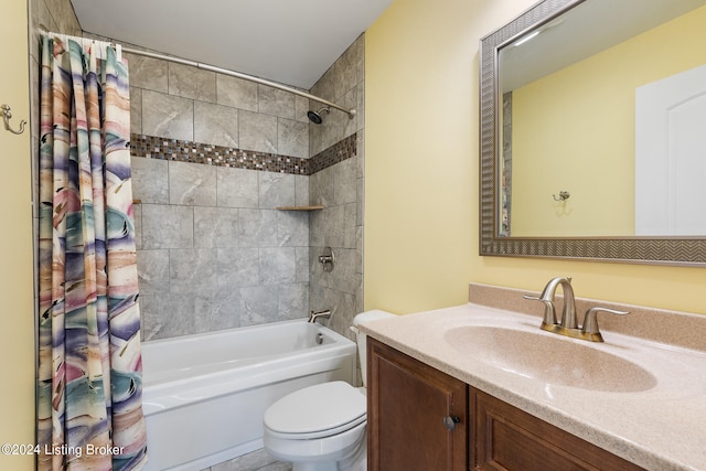 full bathroom with toilet, vanity, and shower / tub combo