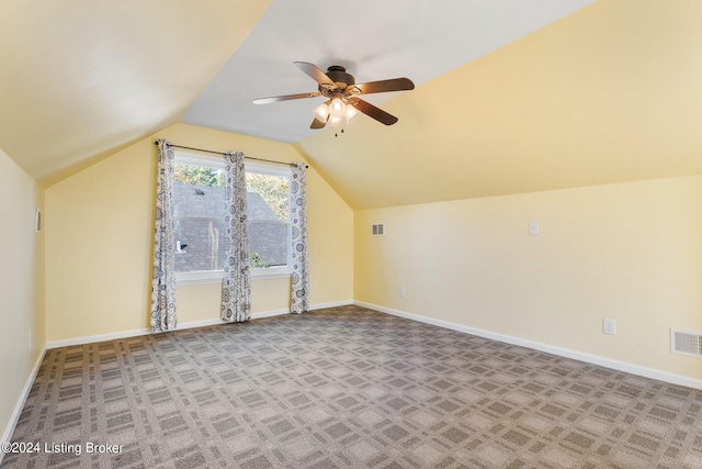 bonus room with ceiling fan, vaulted ceiling, and light colored carpet