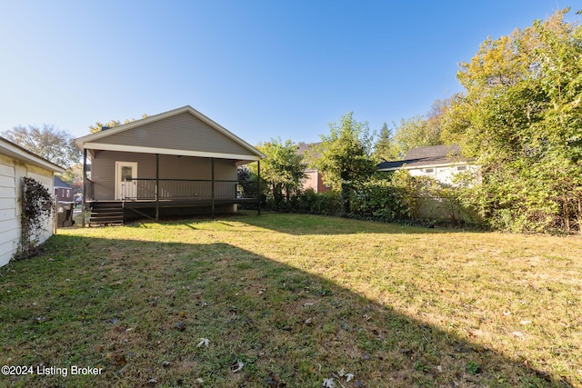 view of yard featuring a wooden deck