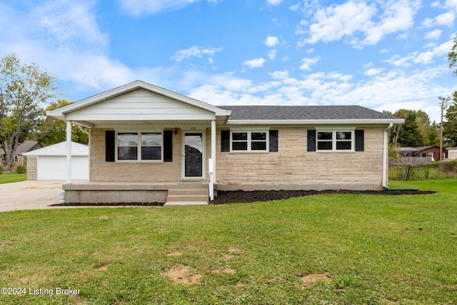 ranch-style house with an outdoor structure, a front lawn, and a garage