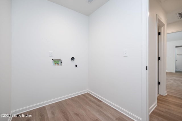 laundry area with hookup for a washing machine, light wood-type flooring, and electric dryer hookup