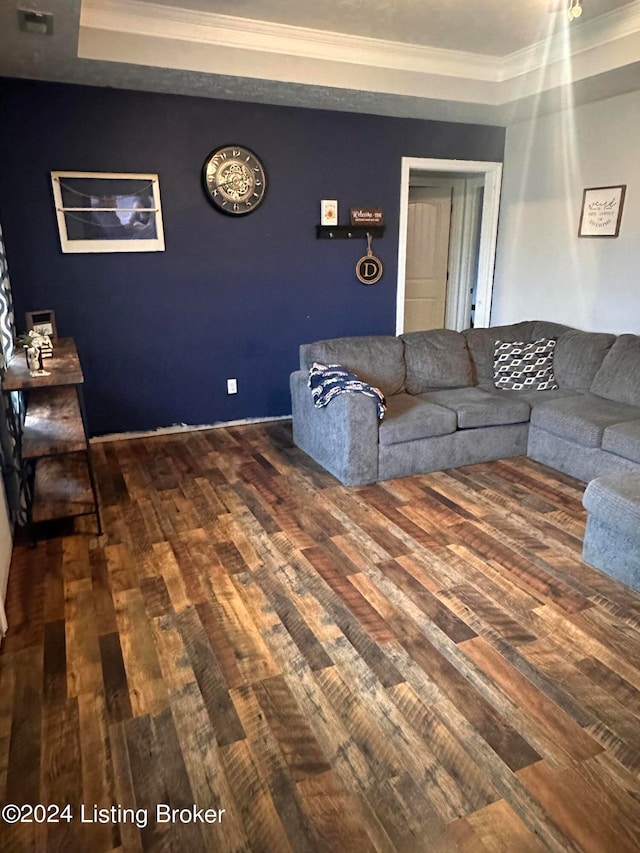 living room with crown molding and dark hardwood / wood-style floors