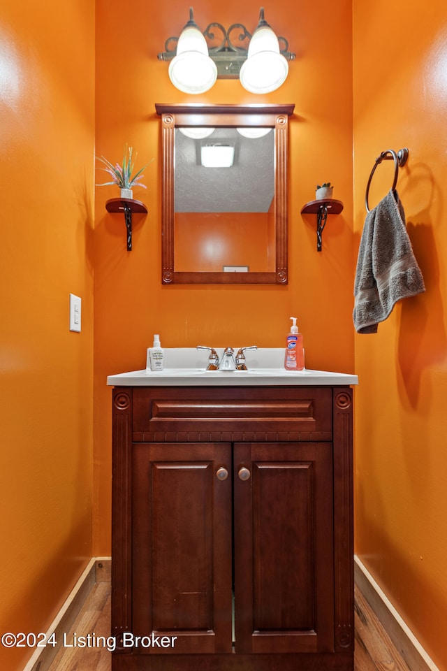 bathroom featuring wood-type flooring and vanity