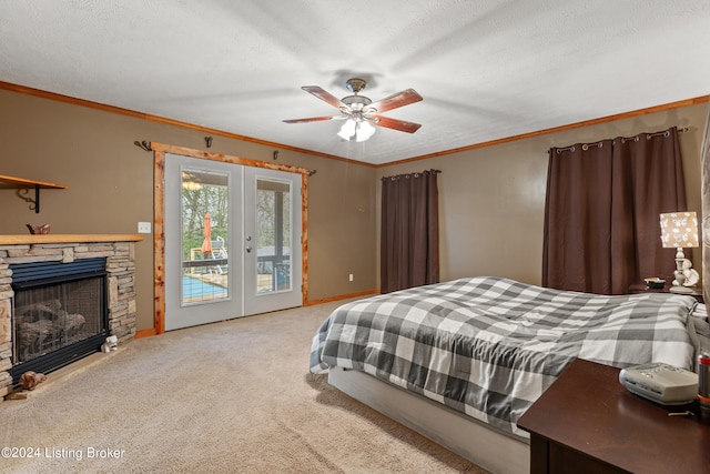 carpeted bedroom with access to exterior, ceiling fan, french doors, and a textured ceiling