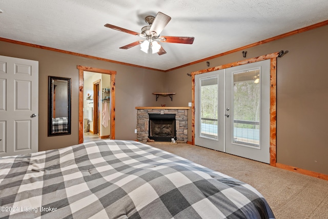 unfurnished bedroom with ceiling fan, french doors, carpet floors, ornamental molding, and a textured ceiling