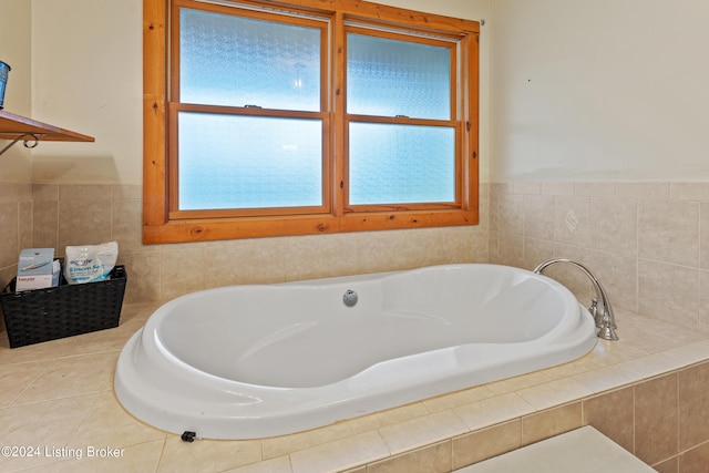 bathroom featuring tiled tub