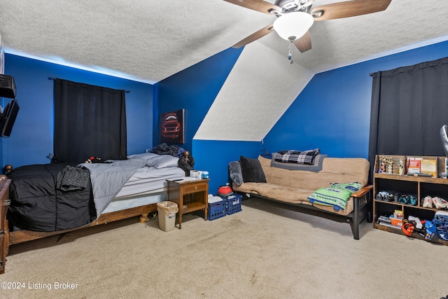 carpeted bedroom with ceiling fan, a textured ceiling, and vaulted ceiling