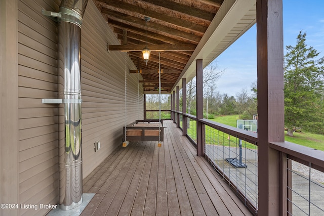 wooden terrace with a yard